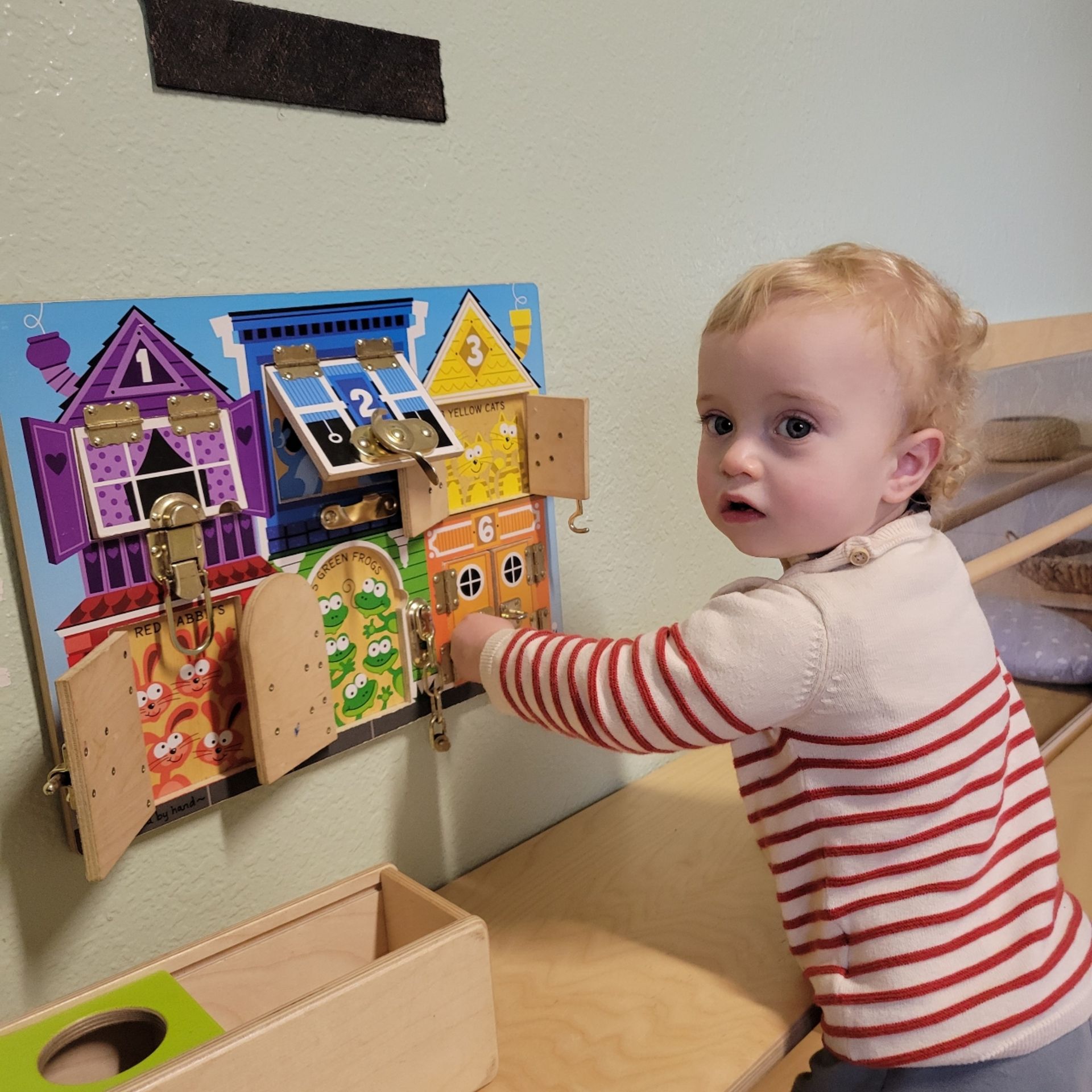 Montessori toddler working with montessori materials