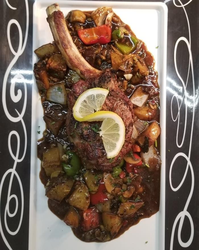 A plate of food with lemon slices on it