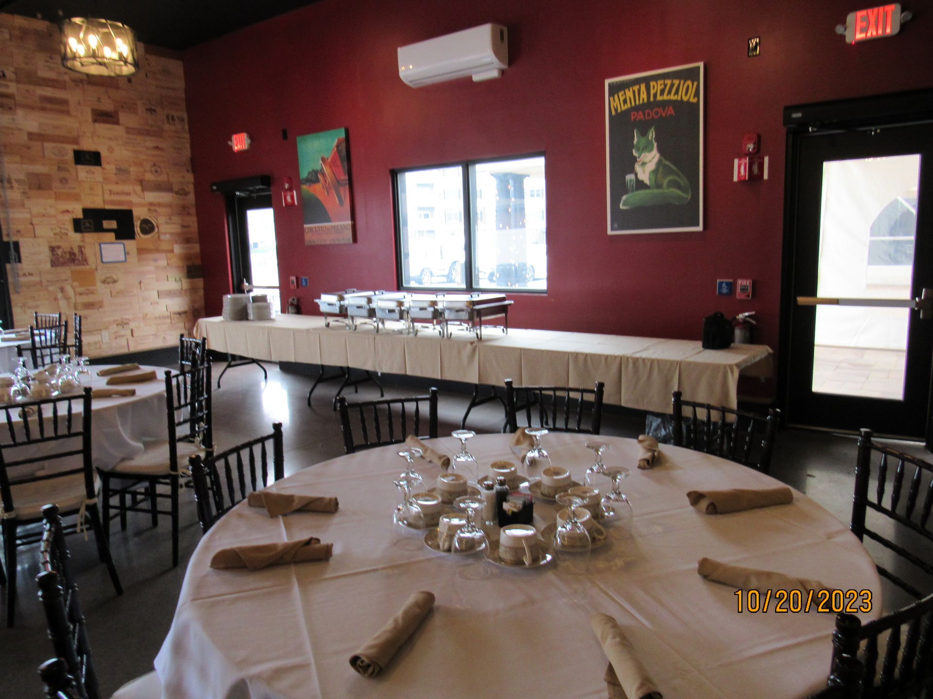 A room with tables and chairs and a sign on the wall that says fox