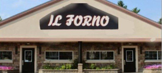 A building with a sign that says il forno on it