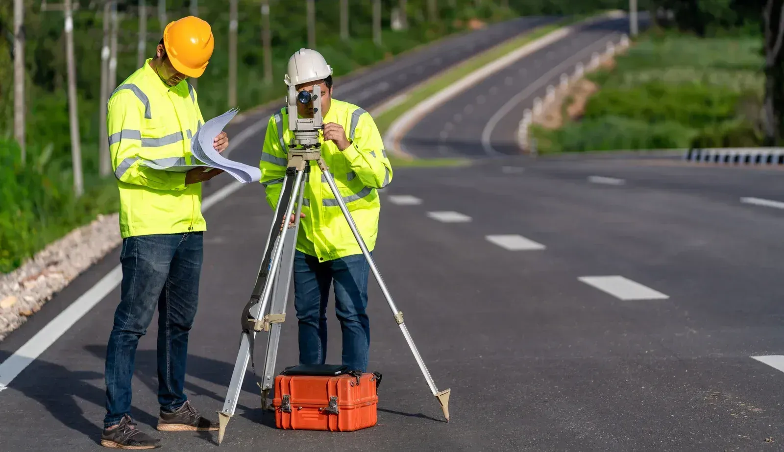 A large house with a lot of windows and a garage on a rainy day.