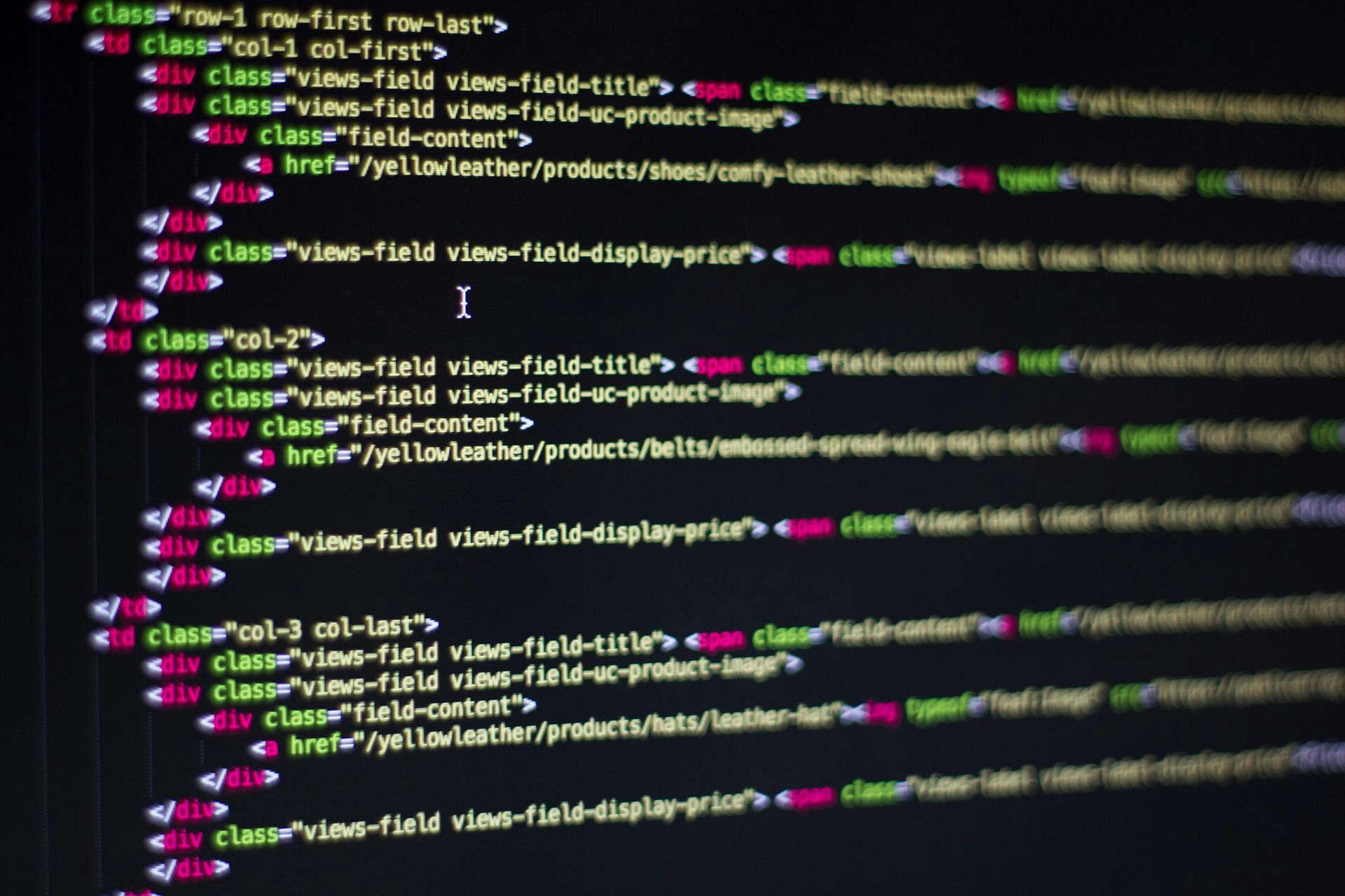 Code is displayed on a computer screen. The code appears to be for a website with complex features.