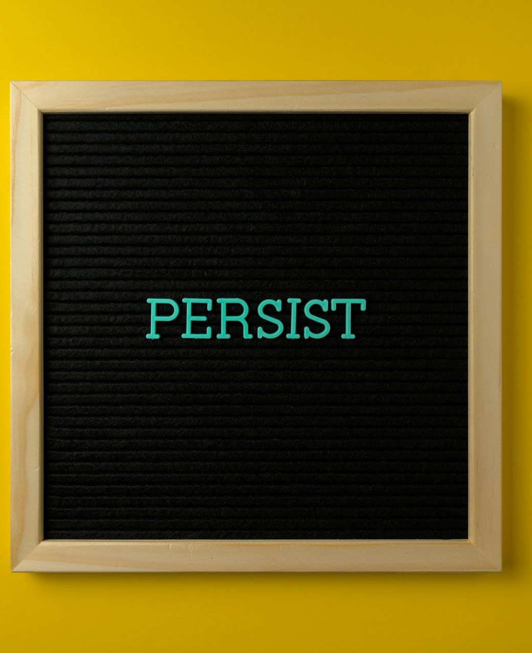 Black felt letter board with the word 