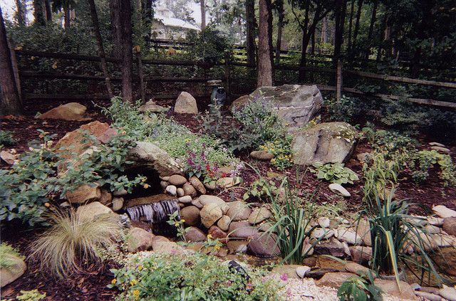 A rock garden with a waterfall in the middle of it