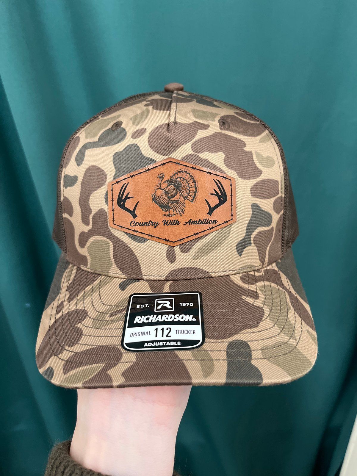 Camouflage Richardson trucker hat with leather turkey patch