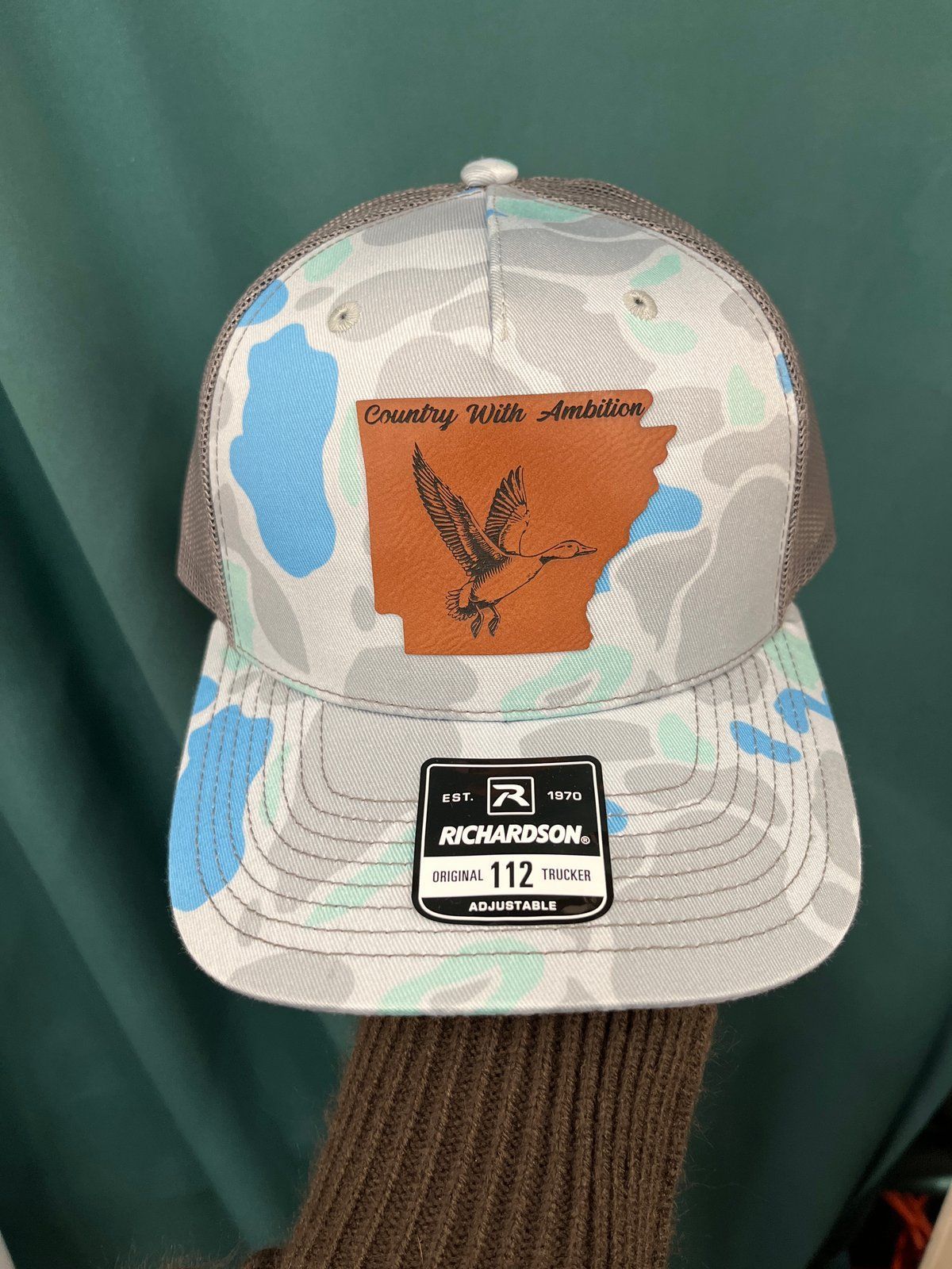 Blue camo Richardson hat with brown leather duck patch