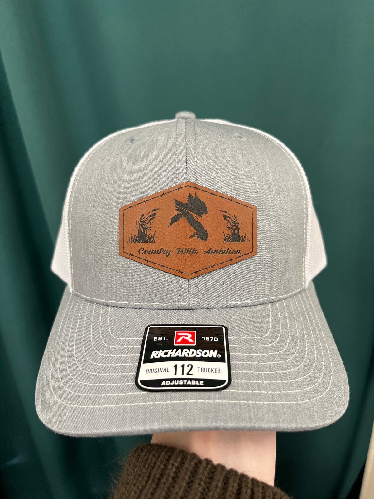 Camouflage Richardson trucker hat with leather duck patch