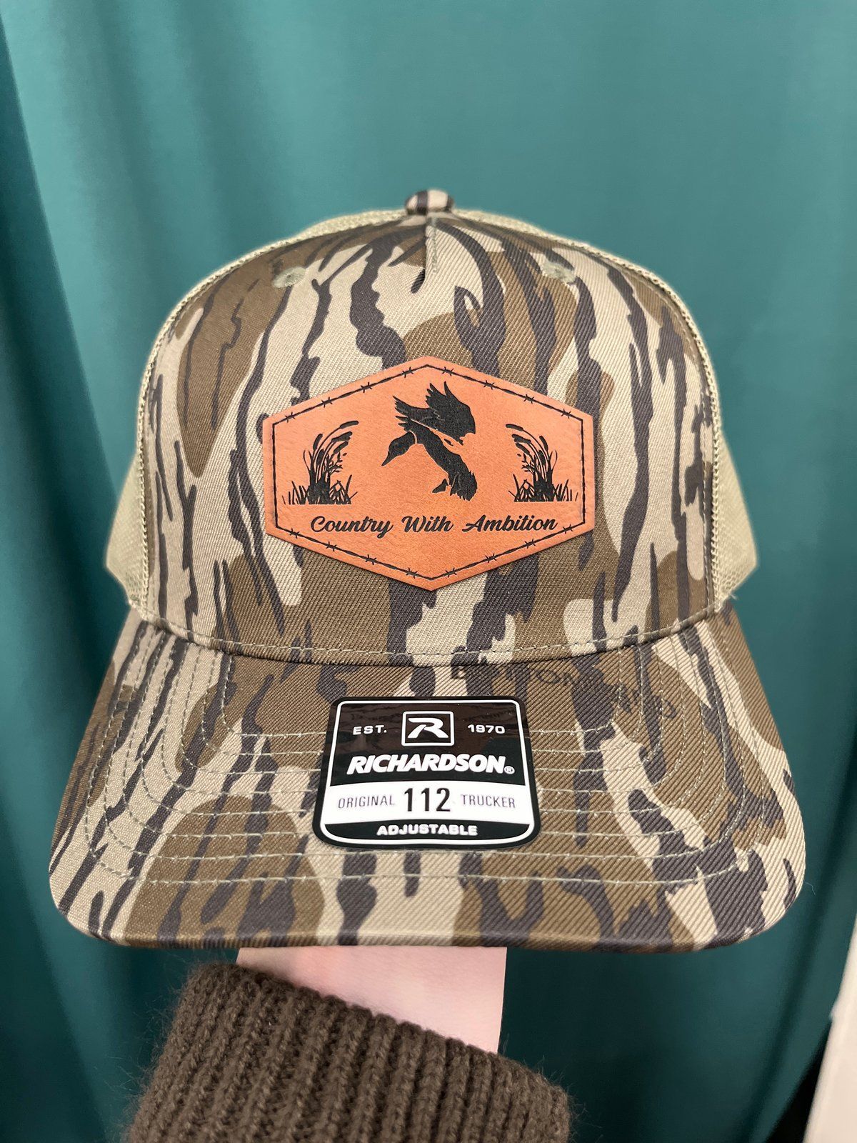 Camouflage Richardson trucker hat with leather duck patch