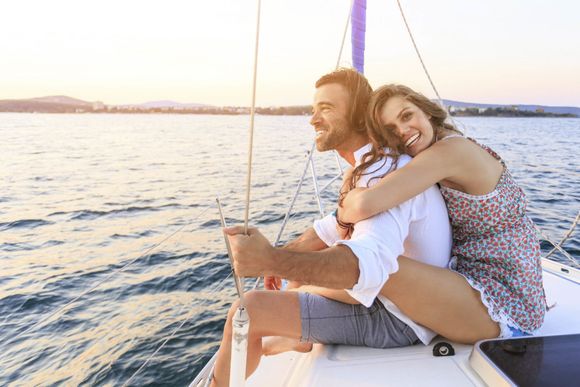 Couple on honeymoon traveling with yacht