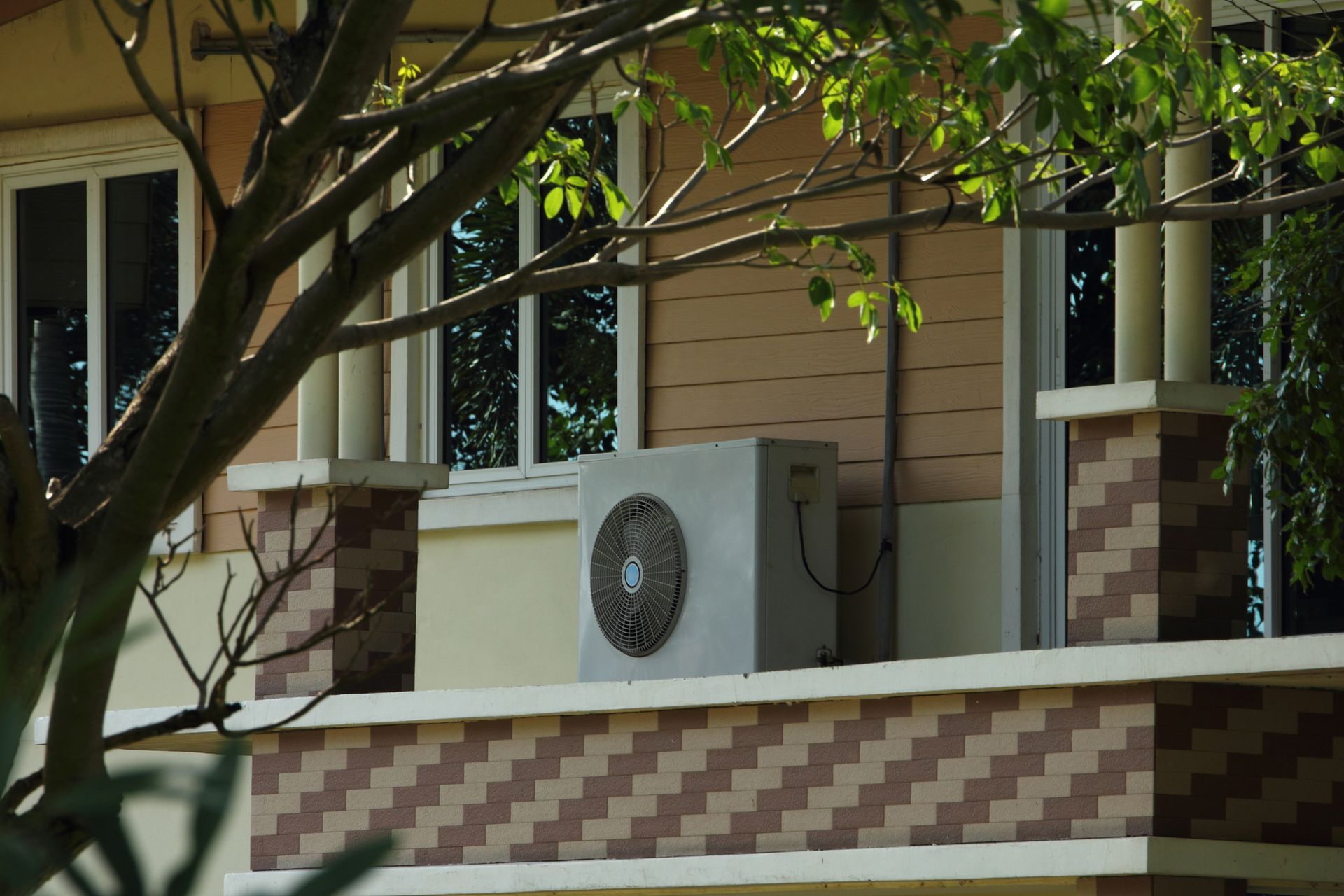 A house with a large air conditioner on the side of it