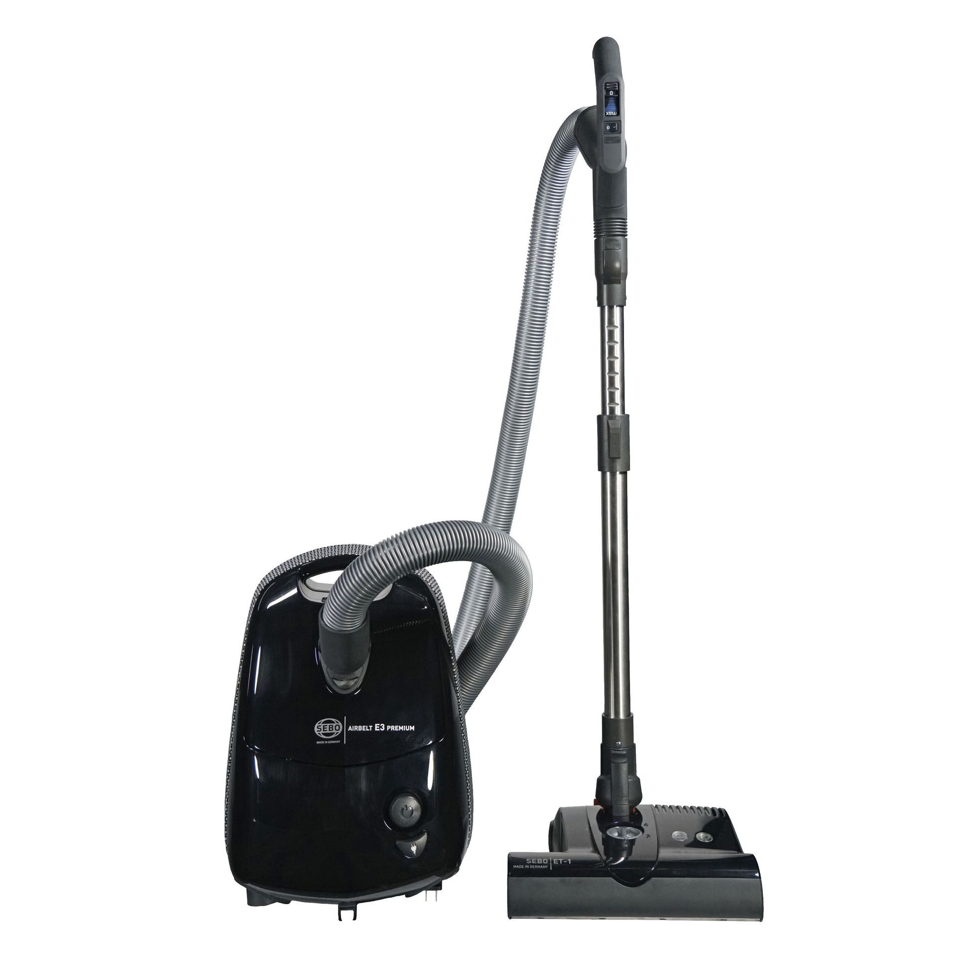 Black canister vacuum cleaner with hose and wand.
