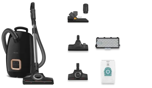 Black Miele canister vacuum cleaner with attachments, on a white background.