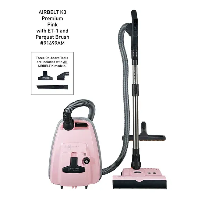 Pink Airbelt K3 vacuum cleaner with attached hose, brush head, and on-board tools.