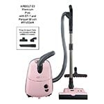 Pink Miele vacuum cleaner with attachments, including a parquet brush.