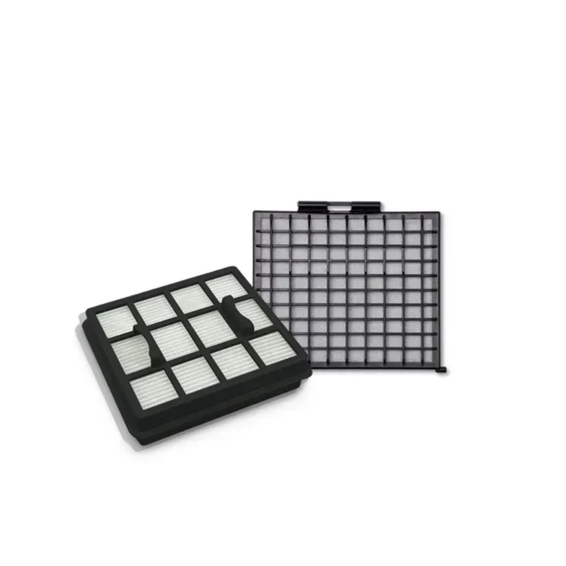 Two black and white vacuum filters. One is next to a larger, empty filter housing.