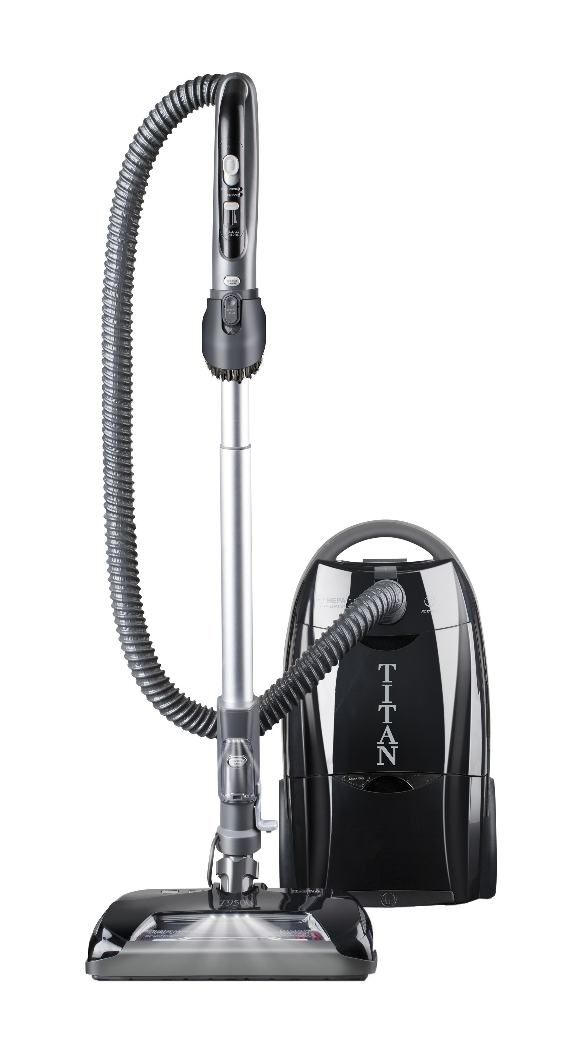 Black and silver Titan vacuum cleaner with hose, wand, and floor brush.