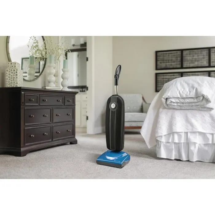 Blue and black upright vacuum cleaner with silver handle.