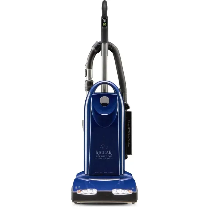 Blue Riccar vacuum cleaner with a long handle and attached hose, on a white background.