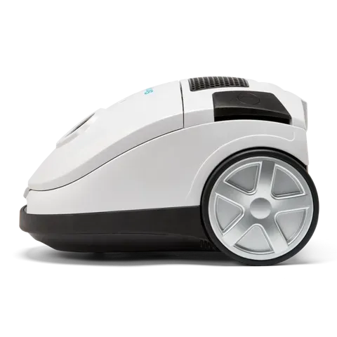 White canister vacuum with black hose and attachments.