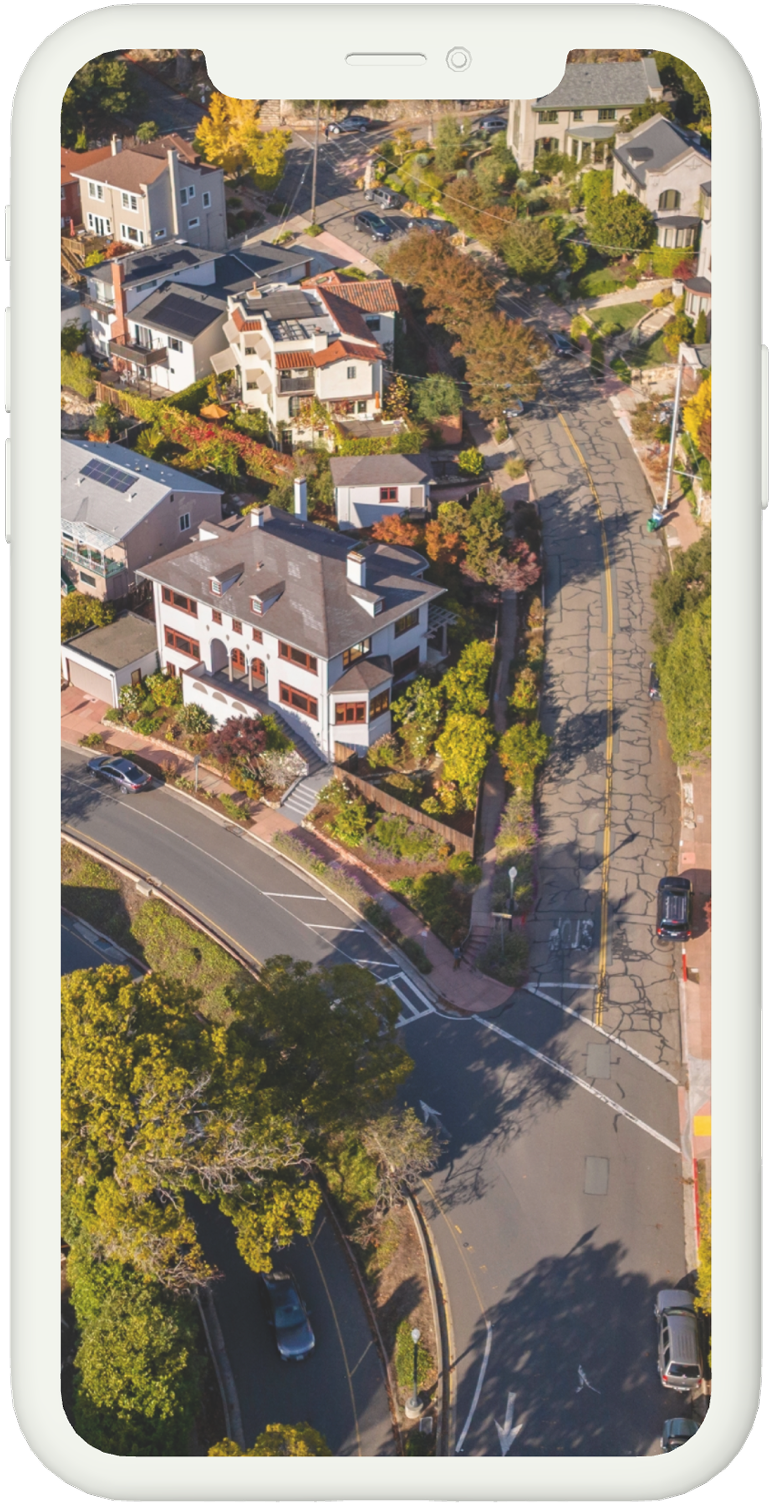 An aerial view of a residential area on a cell phone.