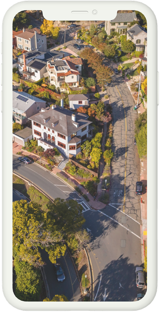 An aerial view of a residential area on a cell phone.