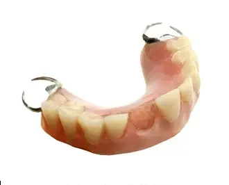 Close Up of a Denture on a White Background — Cosmetic Denture Services–Jacob Maxwell in Sarina, QLD