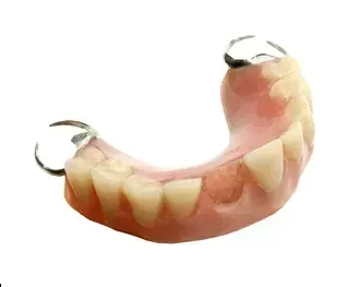 Close Up of a Denture With Metal Claws on a White Background — Cosmetic Denture Services–Jacob Maxwell in Proserpine, QLD