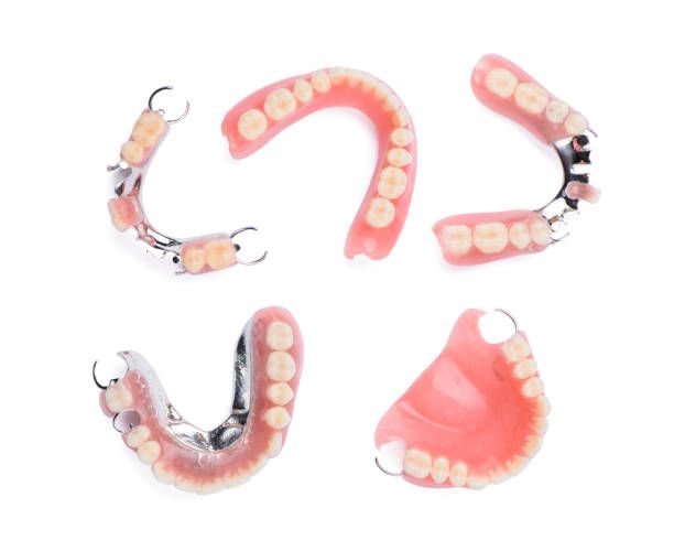 Set of Four Dentures on a White Background — Cosmetic Denture Services–Jacob Maxwell in Mackay, QLD