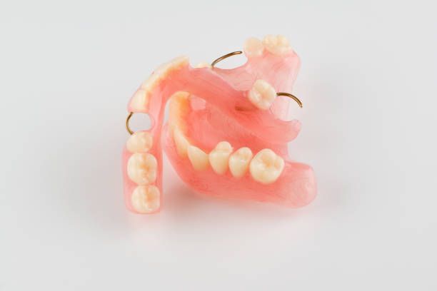 Close Up of a Denture on a White Surface — Cosmetic Denture Services–Jacob Maxwell in Mackay, QLD