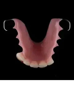 Close Up of a Denture on a Black Background — Cosmetic Denture Services–Jacob Maxwell in Mackay, QLD