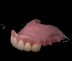 Close Up of a Denture on a Black Background — Cosmetic Denture Services–Jacob Maxwell in Mackay, QLD