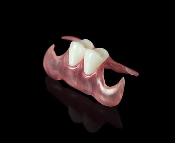 Close Up of a Denture on a Black Background — Cosmetic Denture Services–Jacob Maxwell in Mackay, QLD