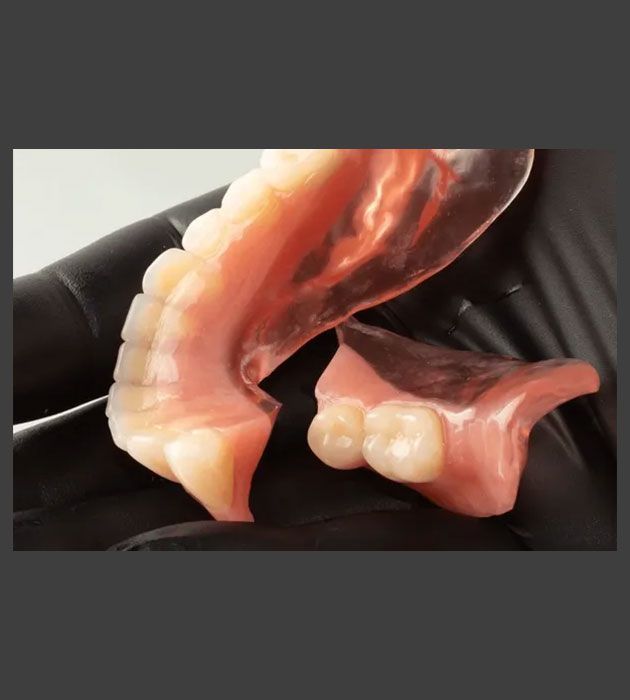 Close Up of a Denture With a Black Background — Cosmetic Denture Services–Jacob Maxwell in Mackay, QLD