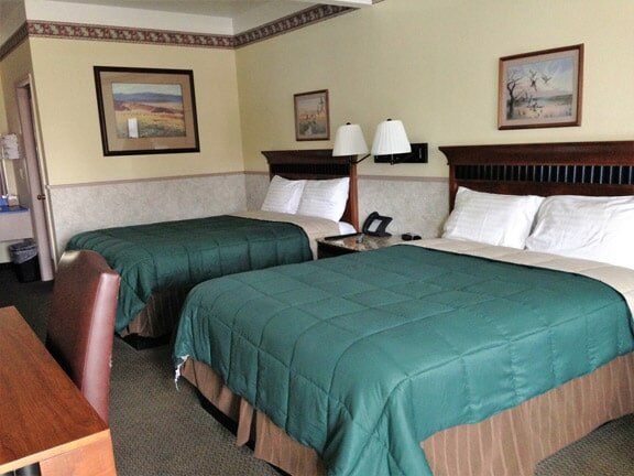 Teal Colored Bed -Friendly Hotel in Glenwood Springs, CO