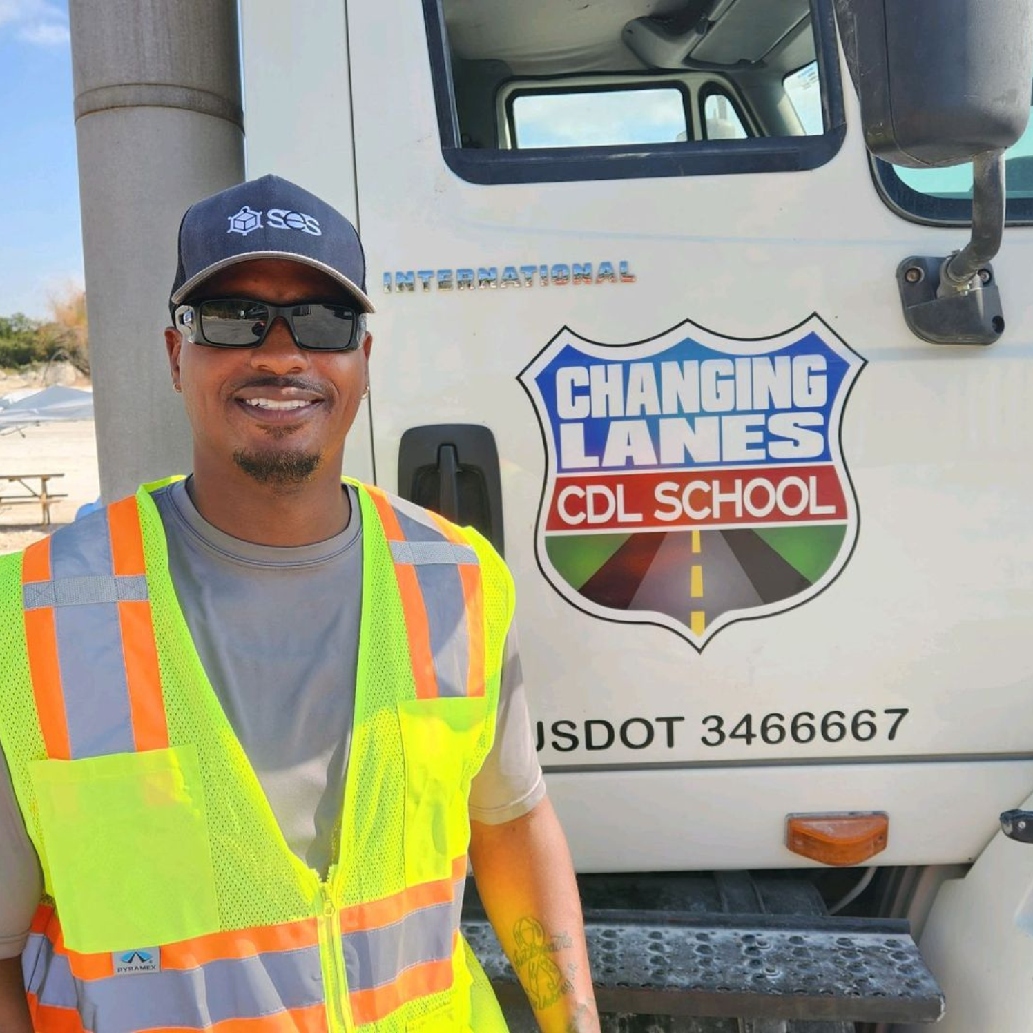 student standing in front of truck
