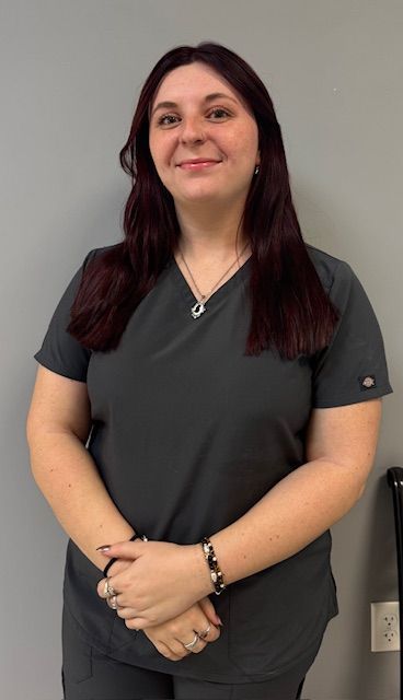 A blue icon of a person without a face on a white background.