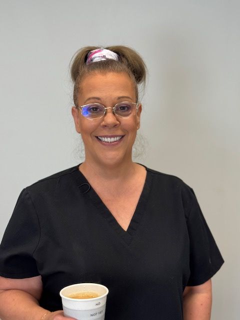 A blue icon of a person without a face on a white background.