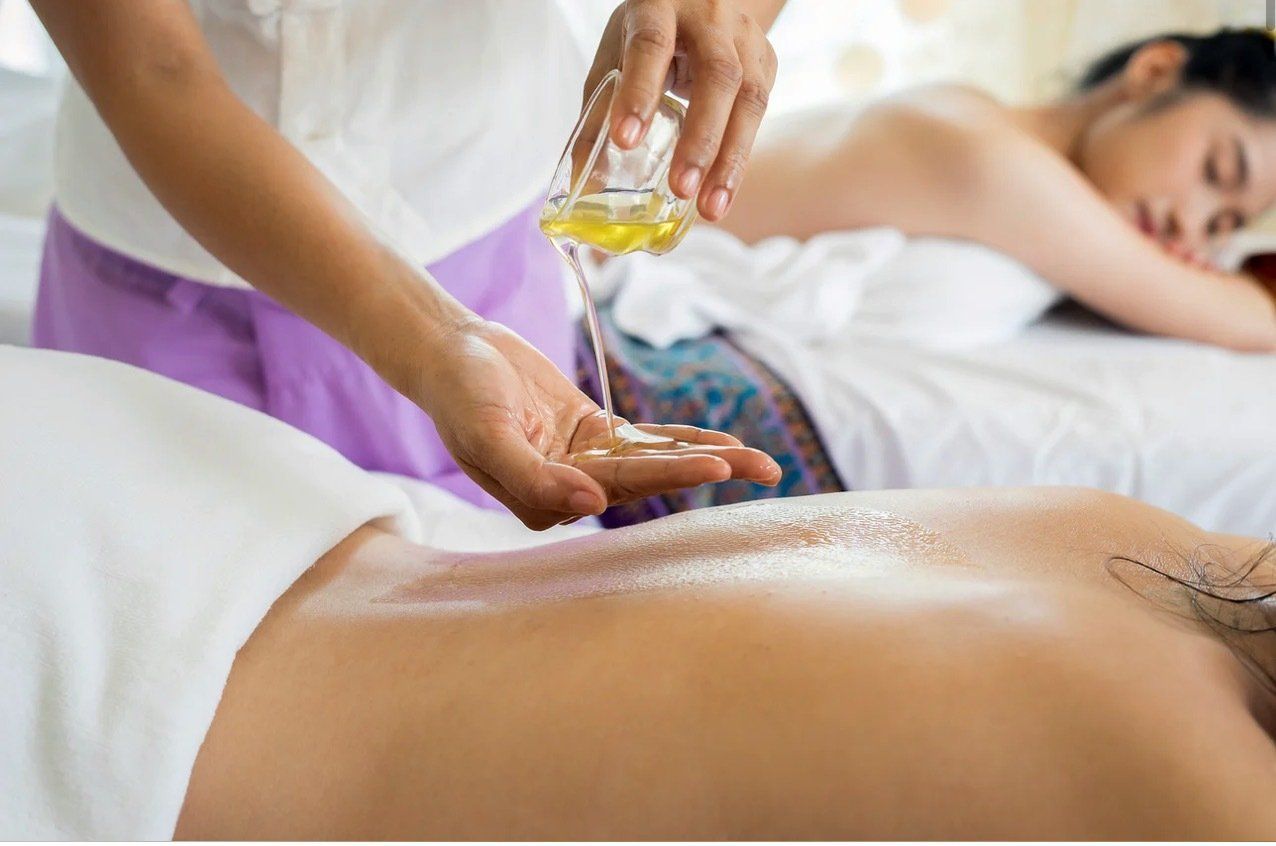 A woman is getting a massage at a spa.