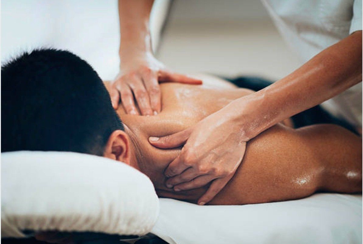 A man is getting a massage at a spa.