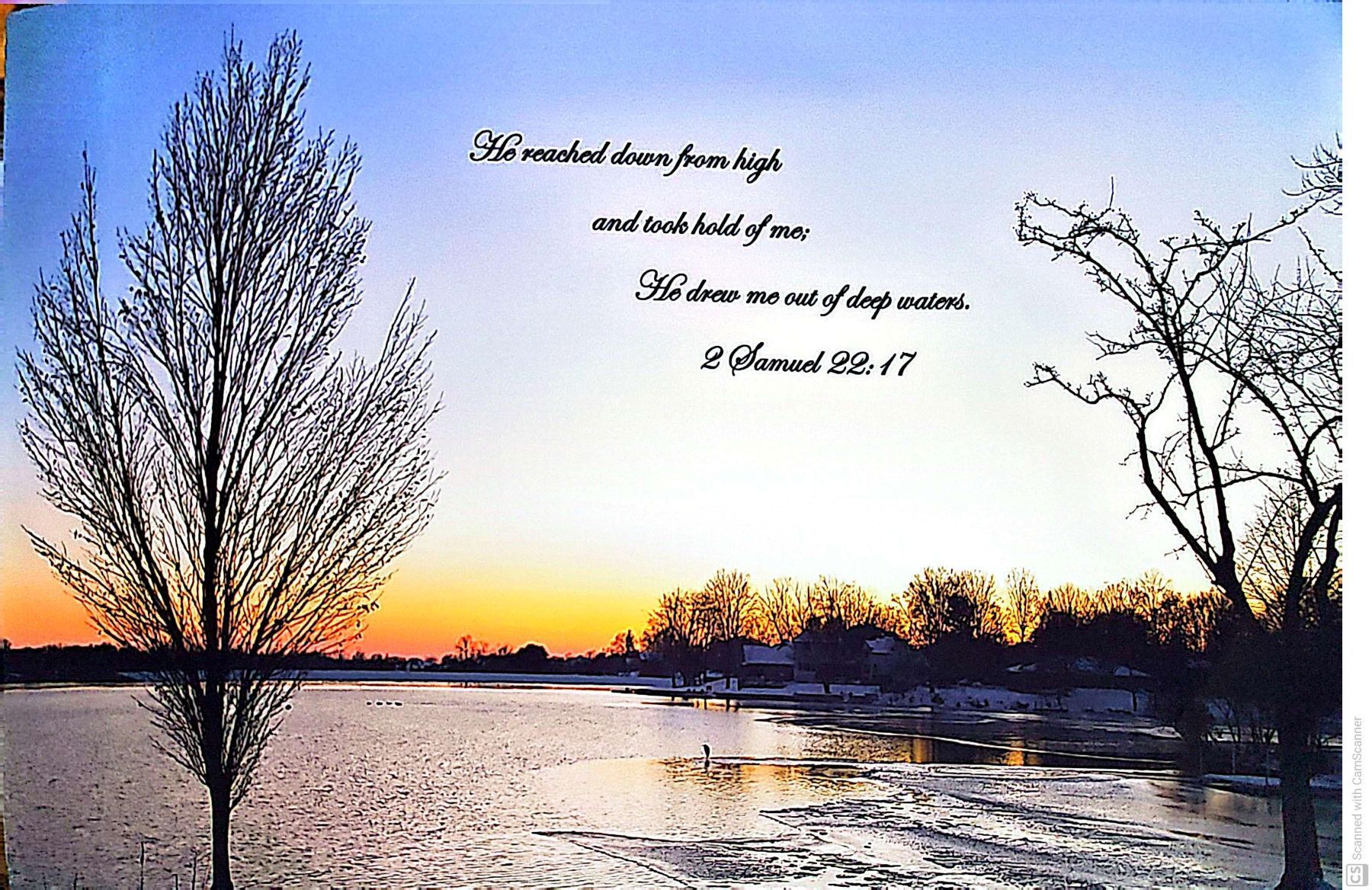 Sunset over a frozen lake with bare trees. Text: “He reached down from high and took hold of me.”