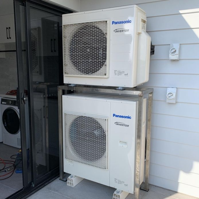 Two Panasonic Air Conditioners Are Stacked On Top Of Each Other — Cool & Secure In Warana, QLD