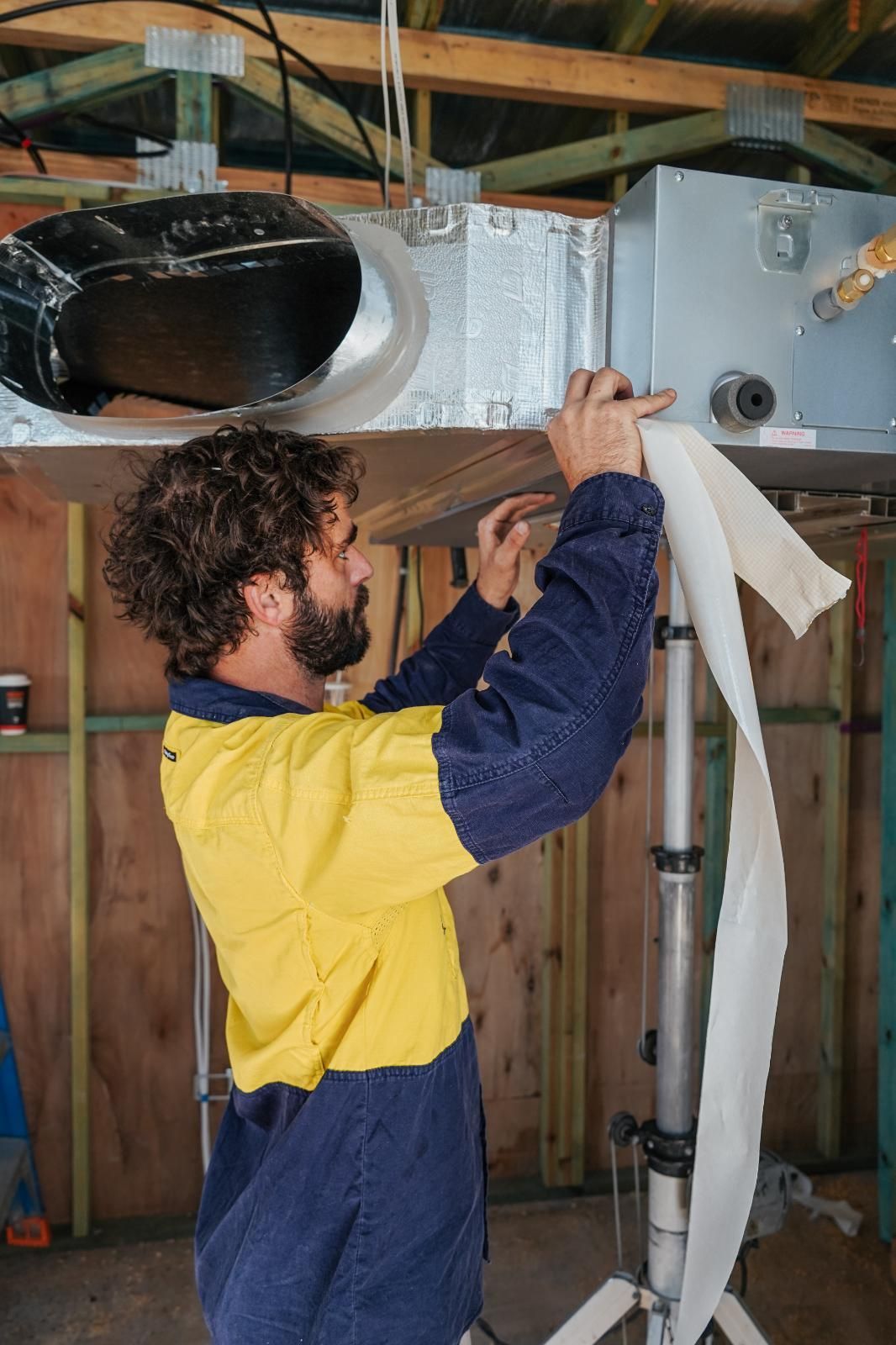 Worker Installing Air Conditioning
