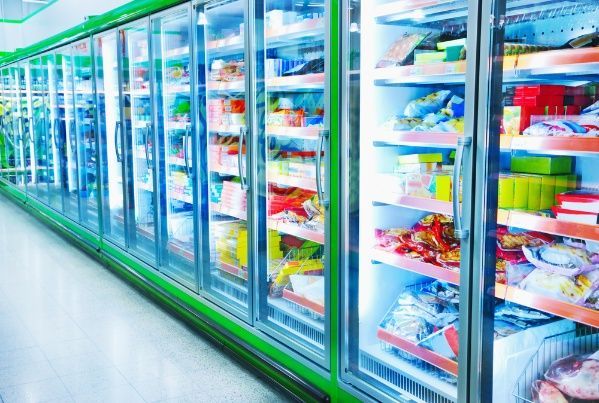 A Row Of Refrigerators In A Grocery Store Filled With Food — Cool & Secure In Buderim, QLD