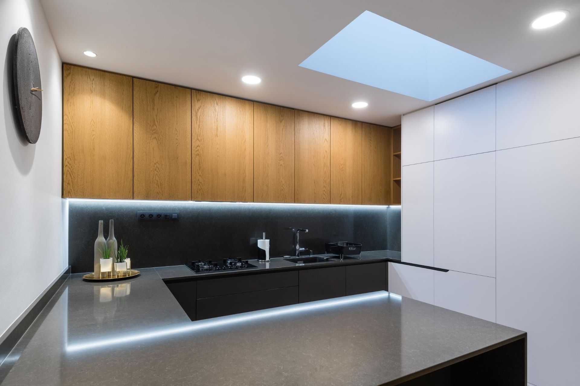 A Kitchen With a Skylight Above the Counter and a Clock on the Wall — Lennox Build In Lismore, NSW