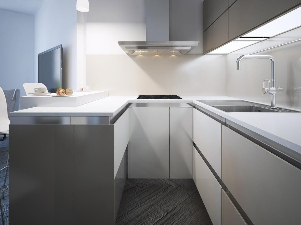 A Kitchen With White Cabinets and Stainless Steel Appliances — Lennox Build In Brunswick Head, NSW