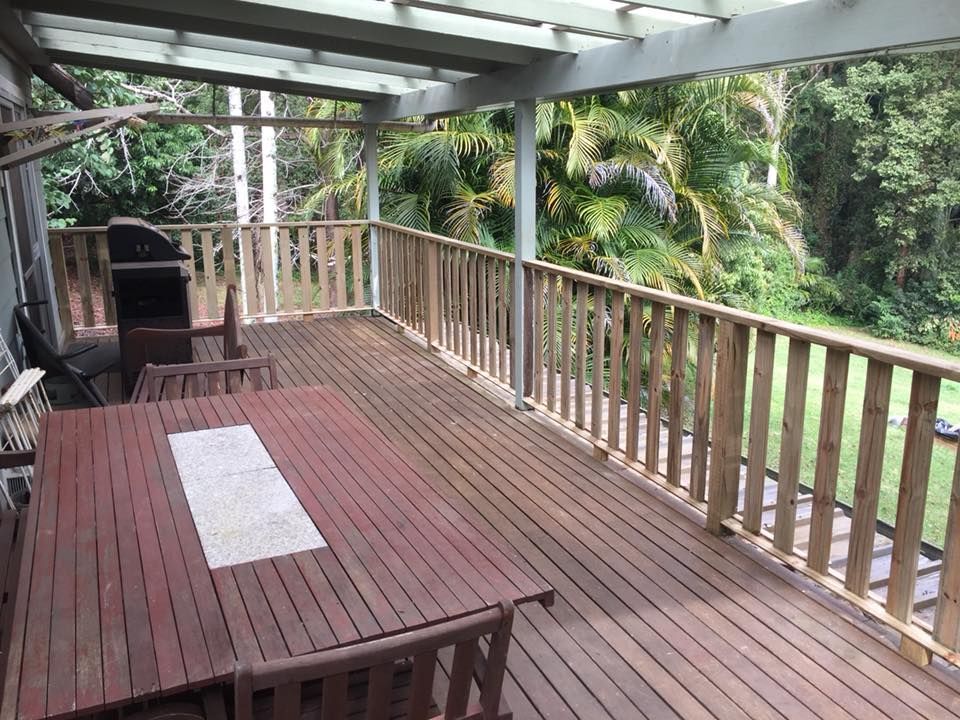 A Wooden Deck With a Table and Chairs on It — Lennox Build In Ballina, NSW