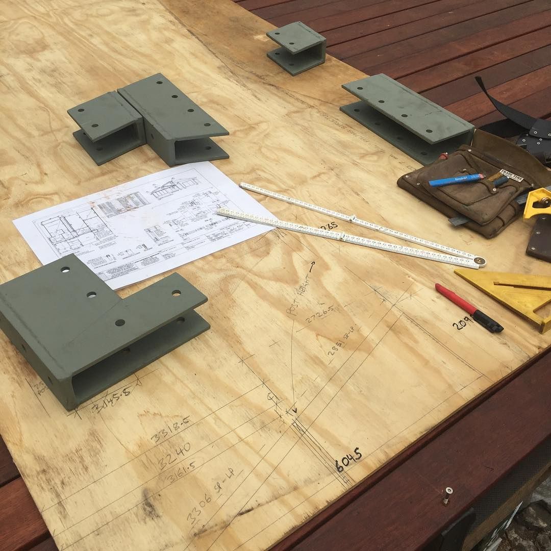 A Wooden Table With a Piece of Paper — Lennox Build In Bangalow, NSW