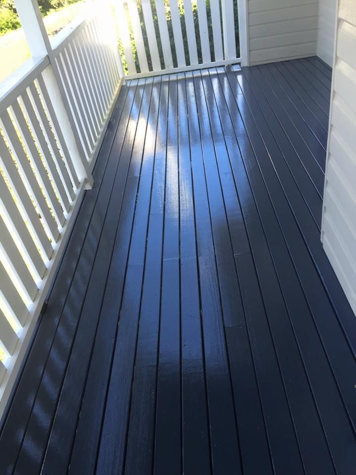 A Black Wooden Deck With a White Railing on a House — Lennox Build In Byron Bay, NSW