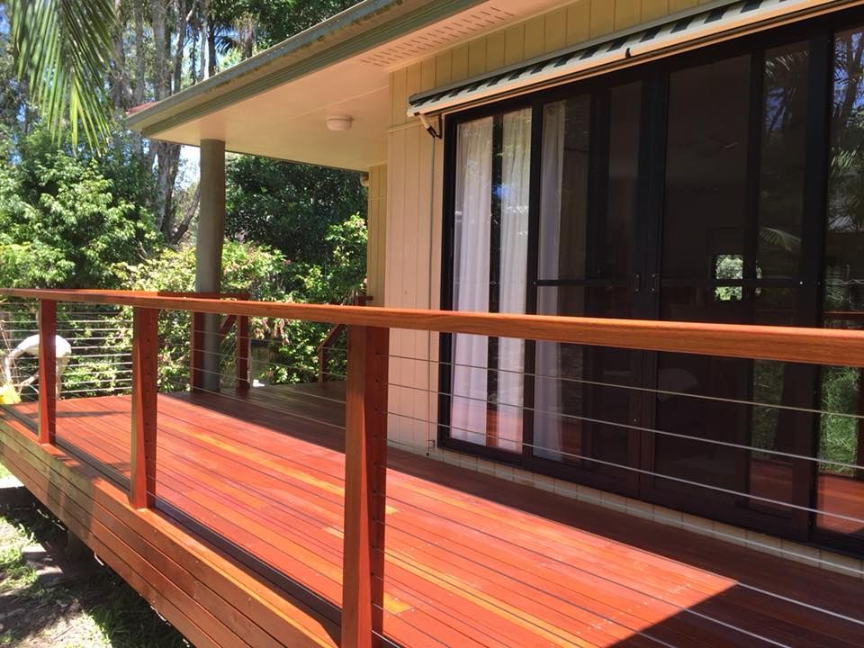 A House With a Wooden Deck and Sliding Glass Doors — Lennox Build In Lennox Head, NSW