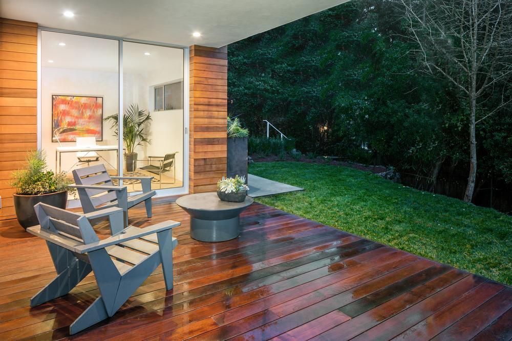 A Wooden Deck With Chairs and a Table in Front of a House — Lennox Build In Brunswick Head, NSW